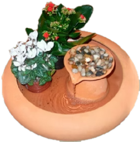 Runder Zimmerbrunnen aus Terrakotta mit Steinen und blühenden Pflanzen